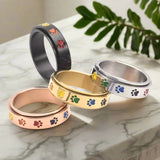 Anello Antistress Rotante in Acciaio Inossidabile con Design a Zampe Arcobaleno